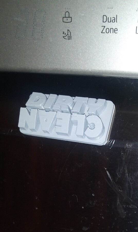 A magnet on a dishwasher with CLEAN and DIRTY sides